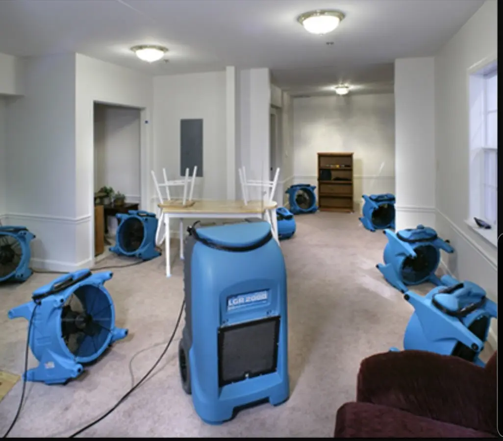 Air movers and dehumidifier setup for Water Damage Restoration in Milltown
